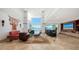 Spacious living room with high ceilings and panoramic views of the serene waterfront at 360 N Washington Dr, Sarasota, FL 34236