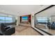 Cozy living room with waterfront views, custom entertainment center, and comfortable seating at 360 N Washington Dr, Sarasota, FL 34236
