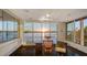 Bright office with a large window overlooking the water, creating a serene and productive workspace at 360 N Washington Dr, Sarasota, FL 34236