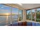 Bright home office with expansive windows offering panoramic views of the water at 360 N Washington Dr, Sarasota, FL 34236