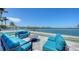 Chic outdoor patio with comfortable seating and views of the pool and bay beyond at 360 N Washington Dr, Sarasota, FL 34236