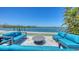 Stylish outdoor seating area perfect for entertaining with waterfront views from the property at 360 N Washington Dr, Sarasota, FL 34236