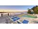 Luxury pool area with comfortable loungers and scenic waterfront views during sunset at 360 N Washington Dr, Sarasota, FL 34236