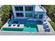 A beautiful backyard pool with cozy outdoor seating and a well-maintained patio deck area at 360 N Washington Dr, Sarasota, FL 34236