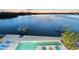 Sunset view of the pool and deck area overlooking the tranquil bay waters at 360 N Washington Dr, Sarasota, FL 34236