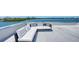 Relax on the rooftop patio with comfortable seating and enjoy views of the serene water at 360 N Washington Dr, Sarasota, FL 34236