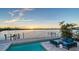 Inviting outdoor pool area overlooking a peaceful waterfront, perfect for relaxation at 360 N Washington Dr, Sarasota, FL 34236