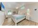 Bright bedroom with vaulted ceilings, white furniture, and ample natural light at 4415 Sylvania Ave, North Port, FL 34286