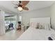 Well-lit bedroom with work space and access to the outdoor pool area at 4415 Sylvania Ave, North Port, FL 34286