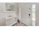 Bright foyer with a decorative mirror, and a white accent table at 4415 Sylvania Ave, North Port, FL 34286