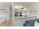 Bright kitchen with white cabinets, stainless steel appliances, and granite countertops at 4415 Sylvania Ave, North Port, FL 34286