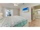 Comfortable main bedroom with ensuite bathroom access and outdoor views at 4415 Sylvania Ave, North Port, FL 34286