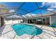 Screened-in pool with patio area featuring lounge seating for outdoor relaxation and entertainment at 4415 Sylvania Ave, North Port, FL 34286