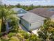 Aerial view of home with a two-car garage, well-maintained landscaping, and manicured lawn at 4529 Golden Gate Cv, Bradenton, FL 34211