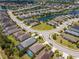 Aerial view of a stunning lakeside neighborhood, showcasing pristine landscaping and charming single-Gathering houses at 4529 Golden Gate Cv, Bradenton, FL 34211