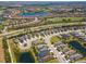 Aerial view of a beautiful golf community with ponds, well-maintained landscaping, and charming single-Gathering homes at 4529 Golden Gate Cv, Bradenton, FL 34211