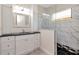 The bathroom features white cabinetry, a glass-enclosed shower, and modern fixtures at 4529 Golden Gate Cv, Bradenton, FL 34211