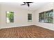 This bedroom has a ceiling fan and features three windows that let in ample light at 4529 Golden Gate Cv, Bradenton, FL 34211