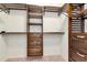 This walk-in closet features custom shelving, drawers, and ample storage space at 4529 Golden Gate Cv, Bradenton, FL 34211