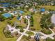 An aerial view of the community park features tennis courts, playground, splash pad, walking paths, and ample green space at 4529 Golden Gate Cv, Bradenton, FL 34211