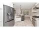 Bright kitchen features stainless appliances, granite counters, and ample white cabinets at 4529 Golden Gate Cv, Bradenton, FL 34211
