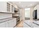 Bright kitchen with stainless steel appliances, granite countertops, and ample white cabinets at 4529 Golden Gate Cv, Bradenton, FL 34211