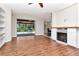 A spacious living room with wood floors leads to a screened-in pool area at 4529 Golden Gate Cv, Bradenton, FL 34211