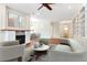 Bright and airy living room with modern furnishings, fireplace, and built-in shelving at 4529 Golden Gate Cv, Bradenton, FL 34211