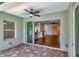 Covered patio featuring a ceiling fan and doorway leading to the house's interior at 4529 Golden Gate Cv, Bradenton, FL 34211
