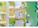 An aerial view of waterfront homes boasting swimming pools and private boat docks on a sunny day at 4908 Commonwealth Rd, Palmetto, FL 34221