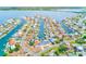 Scenic aerial view of a coastal residential community with waterfront homes, canals, and lush green landscapes at 4908 Commonwealth Rd, Palmetto, FL 34221