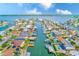 Waterfront property with private dock, pool, and easy access to the ocean, as seen from an aerial view at 4908 Commonwealth Rd, Palmetto, FL 34221