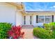 Inviting front entrance with a decorative walkway, complemented by colorful plants and a well-maintained facade at 4908 Commonwealth Rd, Palmetto, FL 34221