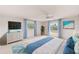 Serene main bedroom with ample natural light, modern furnishings, and a calming coastal color scheme at 4908 Commonwealth Rd, Palmetto, FL 34221