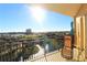 Relaxing balcony area with a lounge chair, side table, and view of a pond and community at 501 Haben Blvd # 704, Palmetto, FL 34221