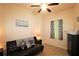 Small bedroom featuring a futon, decorative curtains, wood-look flooring, and modern decor at 501 Haben Blvd # 704, Palmetto, FL 34221