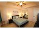 A bedroom featuring mirrored closet doors, a ceiling fan, and bedside tables with lamps at 501 Haben Blvd # 704, Palmetto, FL 34221