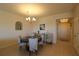 Elegant dining area with chandelier lighting and seating for four at 501 Haben Blvd # 704, Palmetto, FL 34221
