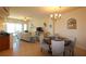 Bright living room with a dining area, cozy seating, and natural light at 501 Haben Blvd # 704, Palmetto, FL 34221