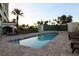 Tranquil community pool area with ample seating, lush landscaping, and a serene atmosphere at 501 Haben Blvd # 704, Palmetto, FL 34221