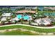Aerial view of the community pool and clubhouse, showing the expansive amenities and landscaping at 5437 Manchini St, Sarasota, FL 34238