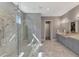 A spa-like bathroom with dual shower heads and a marble tile at 5437 Manchini St, Sarasota, FL 34238