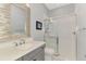 Elegant bathroom with stylish mirror, vanity, and frameless glass shower at 5437 Manchini St, Sarasota, FL 34238