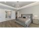 A bedroom featuring tray ceiling, and an ensuite bathroom at 5437 Manchini St, Sarasota, FL 34238