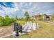 Outdoor chess board with oversized chess pieces, nestled in a beautifully landscaped area for recreational enjoyment at 5437 Manchini St, Sarasota, FL 34238