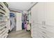 An organized walk-in closet with custom shelving and ample storage space at 5437 Manchini St, Sarasota, FL 34238