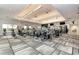 Modern gym equipped with state-of-the-art fitness machines, ceiling fans, and large mirrors for a comprehensive workout experience at 5437 Manchini St, Sarasota, FL 34238