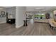 Open-concept living area featuring modern decor, wood floors, and bright, airy space at 5437 Manchini St, Sarasota, FL 34238