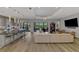 Bright living room featuring an open floor plan connecting to the kitchen and outdoor spaces at 5437 Manchini St, Sarasota, FL 34238