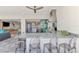Stylish outdoor kitchen equipped with modern appliances and a bar area for entertaining at 5437 Manchini St, Sarasota, FL 34238